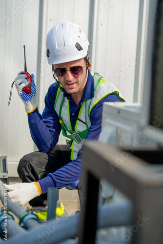 Engineer Inspects Rooftop Cooling System. Maintenance Work On HVAC Equipment.