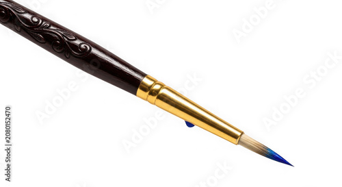 Paintbrush with blue tip on white background