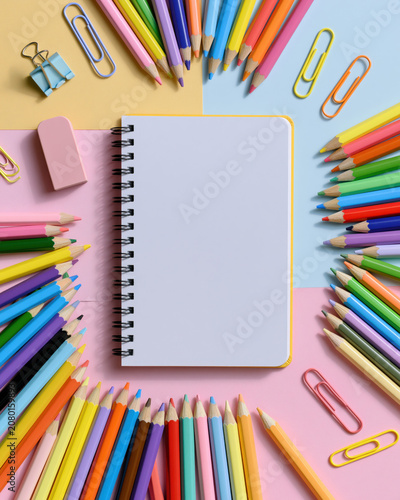 Colorful pencil notebook stationery flat lay playful