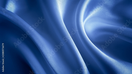 Blue fabric background. Wavy cloth texture