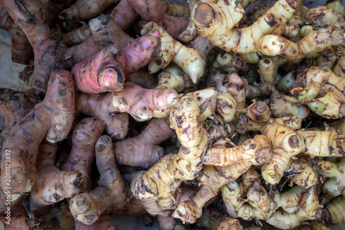 A pile of fresh red and white ginger, Zingiber officinale, in a supermarket in Indonesia