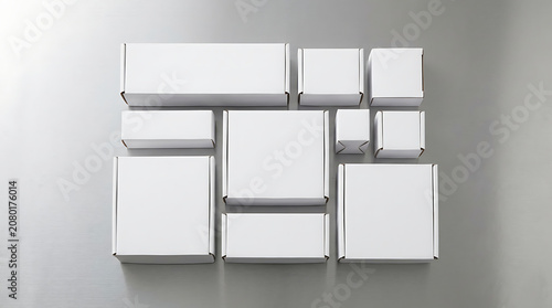 Set of blank white cardboard shipping boxes arranged in grid layout perfect for product packaging mockup template