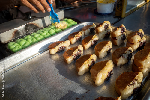 The making process of Kue Pukis, a traditional Javanese  pancakes on street food market, in Yogyakarta, Indonesia