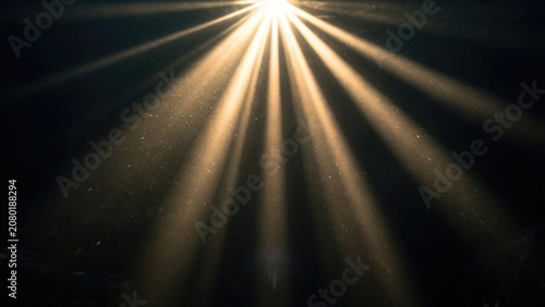 Sunburst Light Rays Through Dark Sky