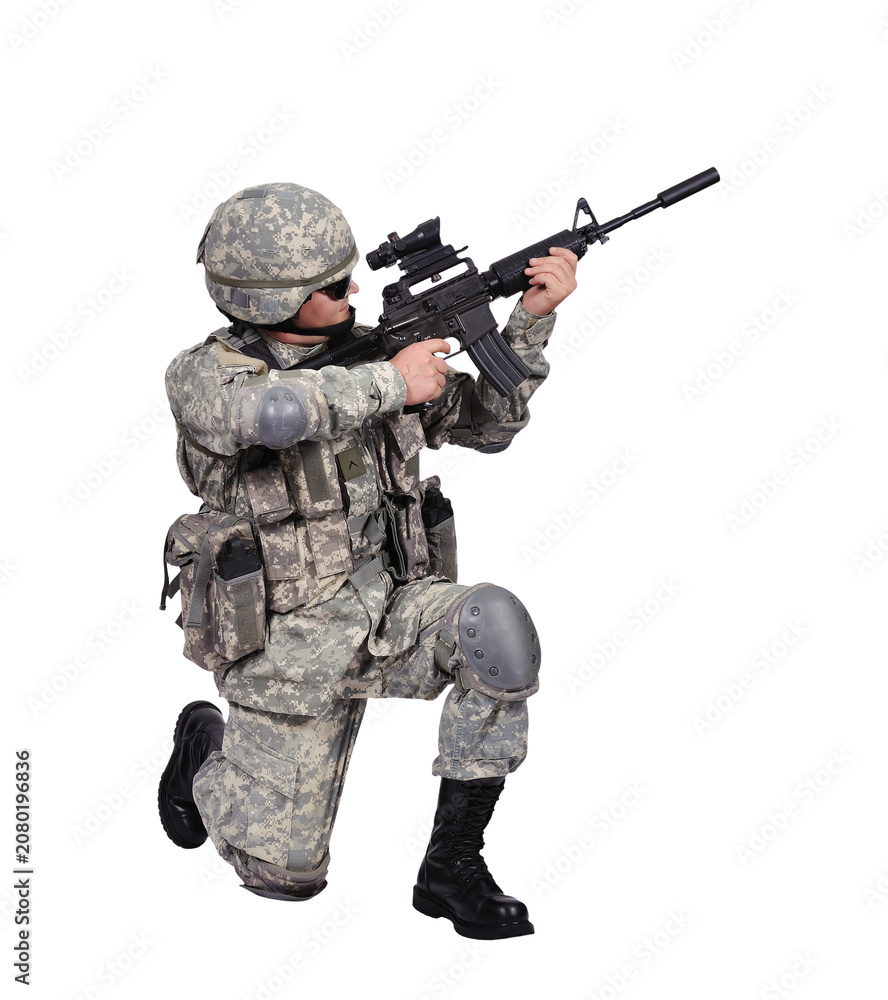 Fototapeta premium Soldier kneeling with rifle. Armed man in camouflage uniform aiming weapon. Military combat training and defense concept.