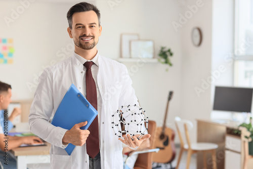 Male Science teacher with c...