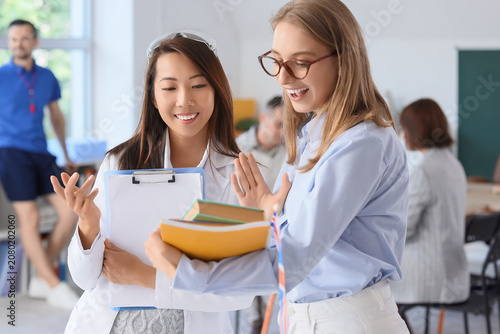 Female teachers with books ...