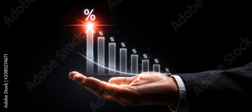 Hand holding ascending financial growth chart with percentage symbol during economic prosperity