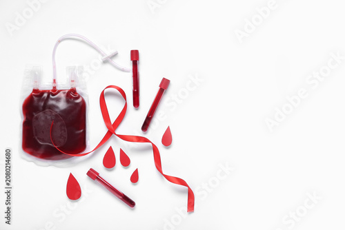 Red ribbon with test tubes,...