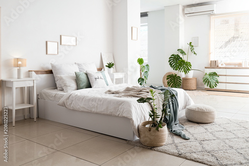 Interior of light bedroom w...