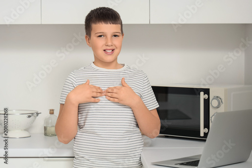 Mute boy using sign languag...