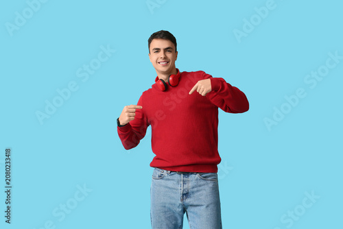Handsome young man pointing...