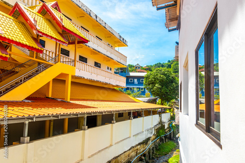 Golden Buddhist Wat Suwankeereewong Temple panorama blue sky in Thailand.