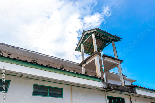 Tropical urban tower rooftop water tanks infrastructure city water system.