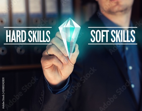 Businessman holding a glowing crystal between hard skills and soft skills