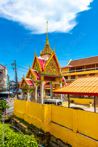 Golden Buddhist Wat Suwankeereewong Temple panorama blue sky in Thailand.