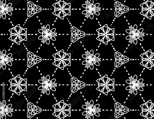 Seamless black and white geometric pattern featuring abstract floral shapes and dashed grid lines. Perfect for modern textiles, wallpaper, and backgrounds.