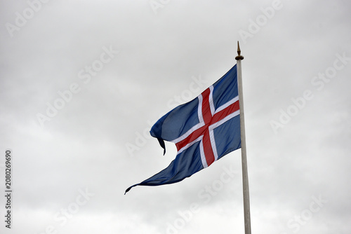 Принти на полотні National flag of Iceland against a cloudy sky