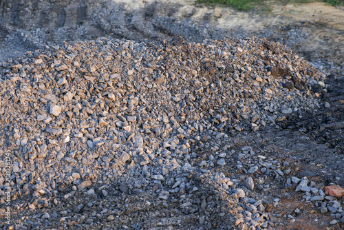 Gravel rock pile quarry ground with rough stone texture at construction site