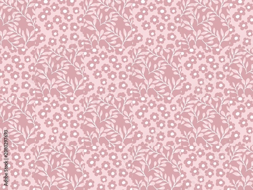 Seamless floral pattern with a pink background featuring small, stylized flowers and white leaf motifs. The design is repetitive, creating a consistent and uniform appearance across the surface. Each 