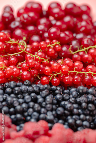 Mix of different ripe tasty berries as background