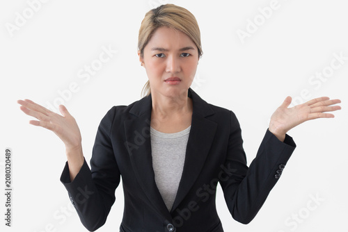 Young Asian Thai business woman shrugging with a confused expression, expressing uncertainty or doubt.