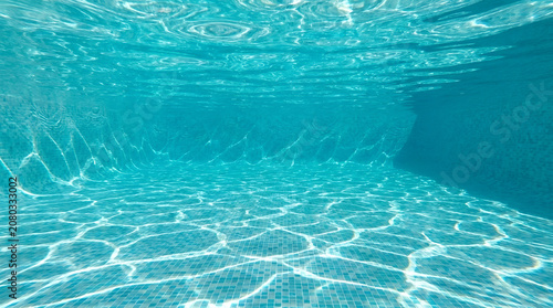 Clear blue underwater swimming pool surface.