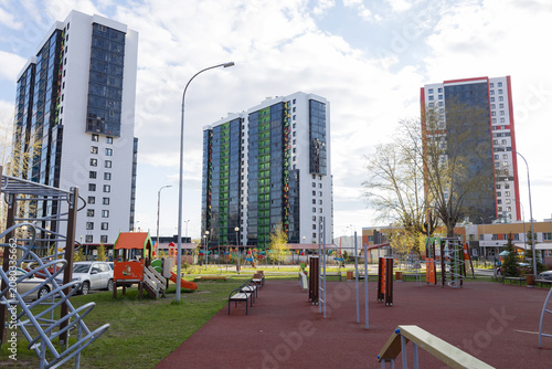 Children's playgrounds near residential buildings, modern residential complexes, infrastructure of new buildings, family mortgages