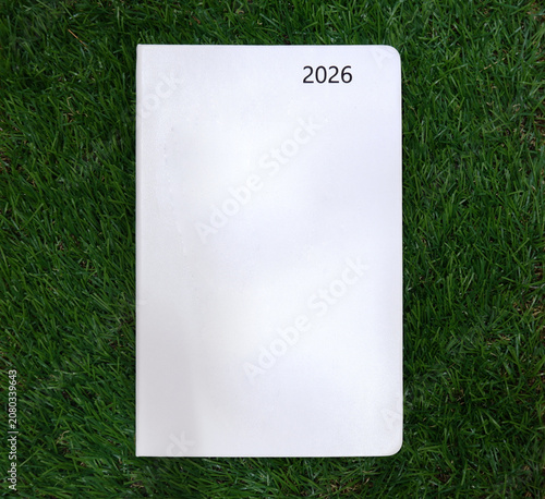A white 2026 diary placed on the lawn, 2026 New Year's plans.
