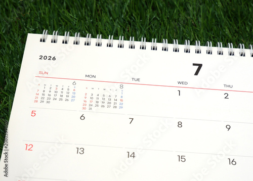 2026 calendar, July 2026 desk calendar placed on the lawn, 2026 New Year's resolutions.