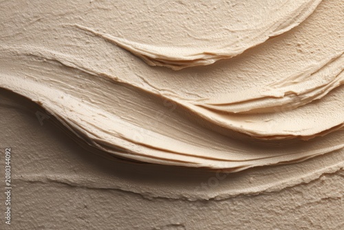 Elegant skincare banner featuring soft and creamy beige texture on a soothing background