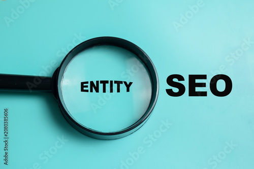 Concept of entity SEO write on book isolated on Wooden Table. For semantic search and search engine understanding