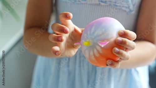 Hands squeeze a soft squishy stress relief toy during sensory play. Tactile interaction promotes relaxation, emotional regulation and stress reduction.