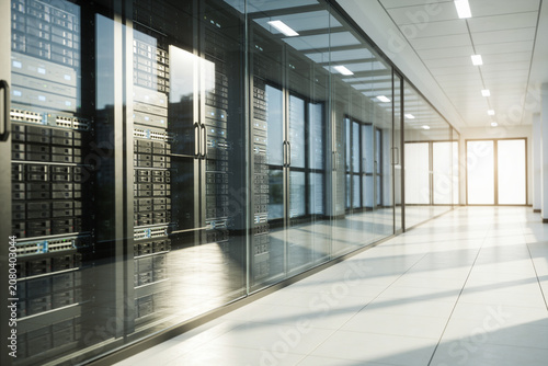Modern server room with racks of equipment behind glass walls