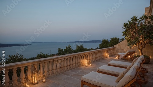 Evening View From Terrace Overlooking Water and City With Lanterns and Lounge...