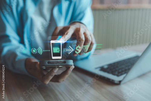 Konstfotografi Cashless payment and digital transaction concept person pointing at smartphone w