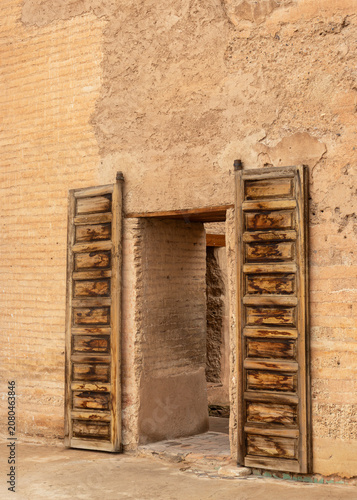 Open Wooden Doors of a Historic Medieval Palace in Marrakech, Morocco
