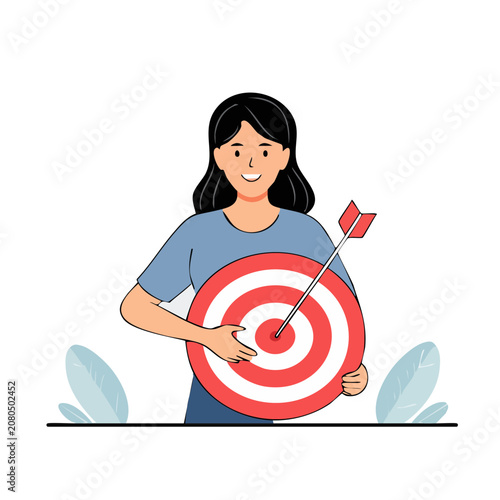 Woman holding target with arrow in bullseye
