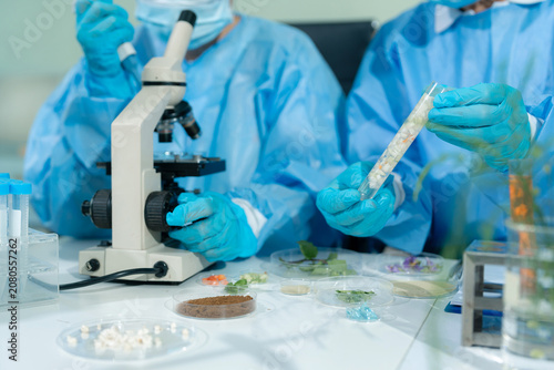 Fotografía Lab work, scientists concentration of chemical residues a test tube in analysis for vaccine development