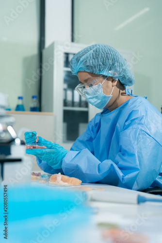 Lab work, scientists concentration of chemical residues a test tube in analysis for vaccine development.