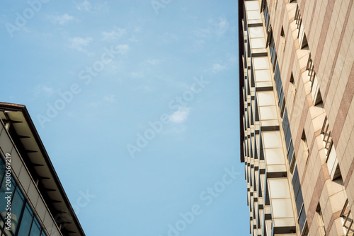 Modern Office Buildings Against Bright Blue Sky Perspective