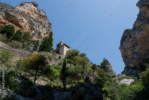 Mountain Chapel Nestled Between Dramatic Limestone Cliffs in Provence, France.