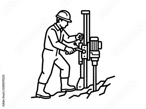A construction worker operates a large drilling machine on a site.