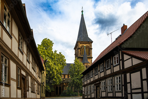 A view through an alleyway towards a church