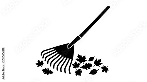 Leaf rake with autumn leaves black silhouette on white background