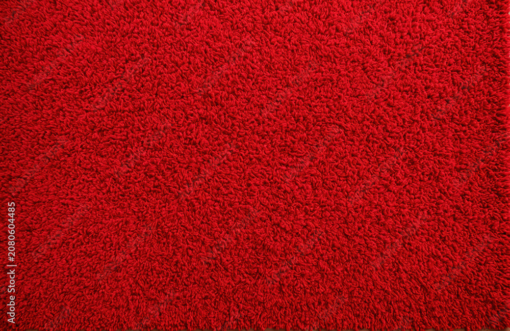 Fototapeta premium Vibrant Red Shaggy Carpet Texture for Modern Interior Home Design Background