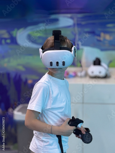 Boy enjoying immersive virtual reality experience in entertainment center