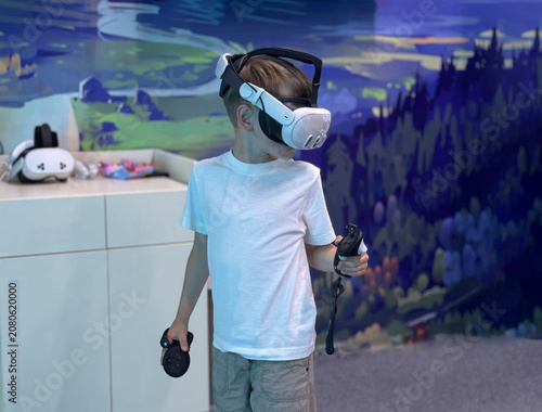Child immersed in a VR game using modern virtual reality equipment in an indoor gaming center.