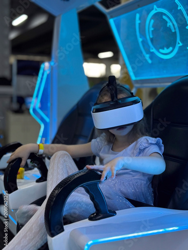 Little girl experiencing virtual reality technology for the first time