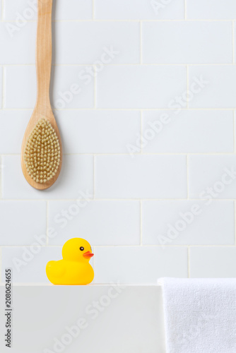 Minimalist baby shower and hygiene mockup scene against white subway tile wall. Bright bathroom vanity backdrop with empty space for toddler shampoo, soap, or organic cosmetics.